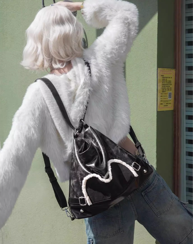 Stylish black tote backpack with heart embellishment - can be worn on one shoulder or as a backpack - Image 9