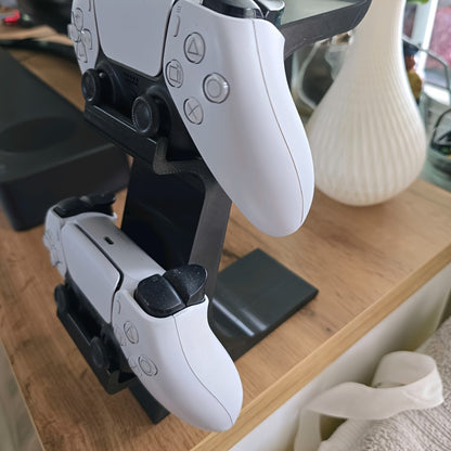 black 3-in-1 PS5 and Xbox Controller Stand – Compatible with PlayStation 5/Xbox Consoles. A gaming desktop organizer with a headphone hanger, non-charging base that holds 2 controllers and headphones. Space-saving white/black console accessory. - Image 3