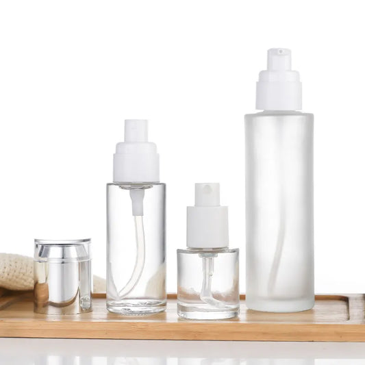 4 Pack Refillable Cosmetic Pump and Spray Bottles with Clear Bodies for Lotion, Shampoo, Soap and Travel Toiletries, White