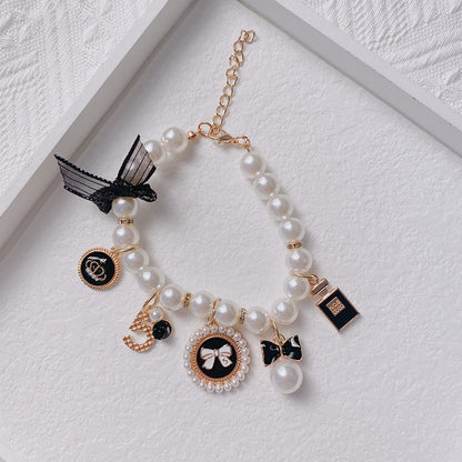 Black 4-PCS Pearl Charm Pet Necklace - Adjustable Bowknot Collar for Small Dogs & Cats (S: 20+5CM) - Image 4