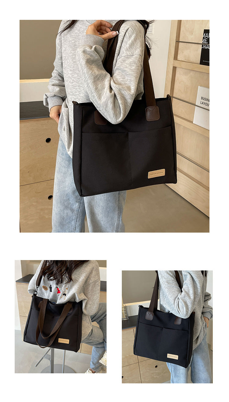 Stylish black canvas tote bag with detachable shoulder strap - Image 2