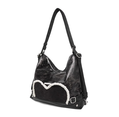 Stylish black tote backpack with heart embellishment - can be worn on one shoulder or as a backpack - Image 3