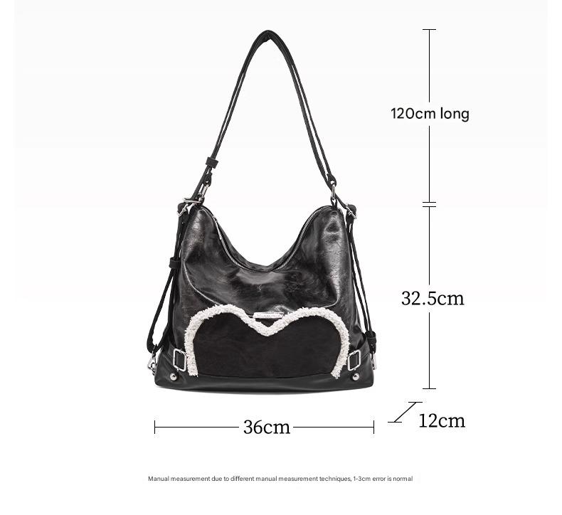 Stylish black tote backpack with heart embellishment - can be worn on one shoulder or as a backpack - Image 4