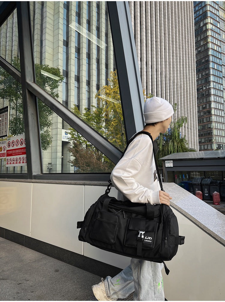 Black Unisex Travel Bag with Utility Buckles and Wet/Dry Compartments - Image 2
