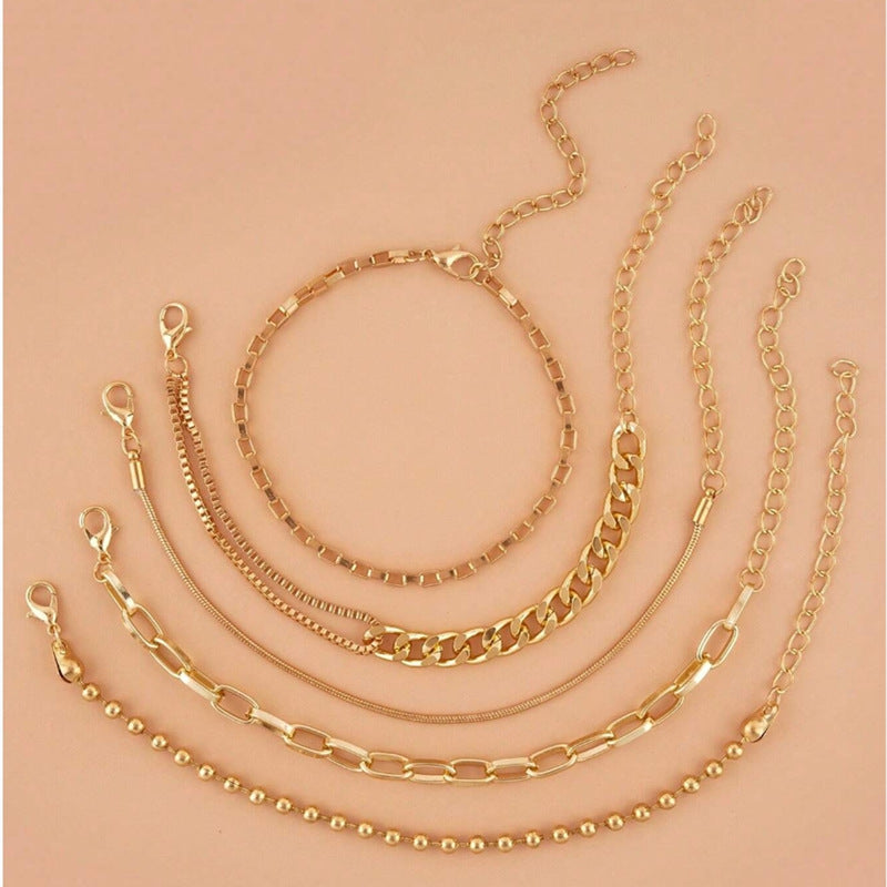 A golden five-piece set Chic Multi-Layered Alloy Bracelet Set - Fashionable Stackable Jewelry - Image 3