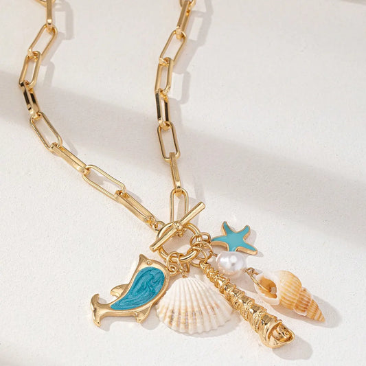 Gold Tone Paperclip Chain Toggle Necklace with Ocean Charms Dolphin Starfish and Seashell Pendant for Summer Beach Holiday