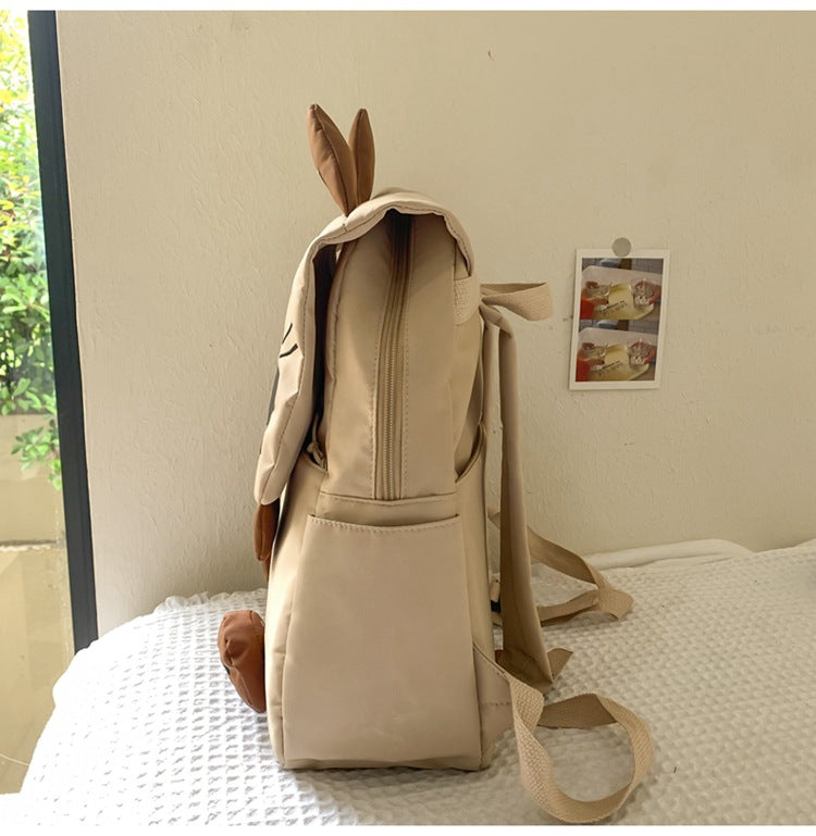 White Lightweight Nylon Waterproof Schoolbag for Children - Large Capacity Daypack with Ugly-Cute Cat Design - Image 2
