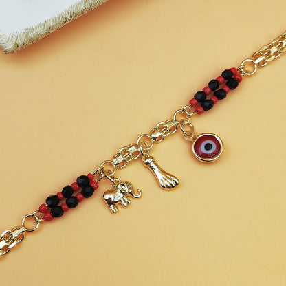Gold-Tone Chain Bracelet with Red and Black Beads, Elephant Charm, Feather Pendant, and Round Stone Accent – 19 cm Length - Image 3