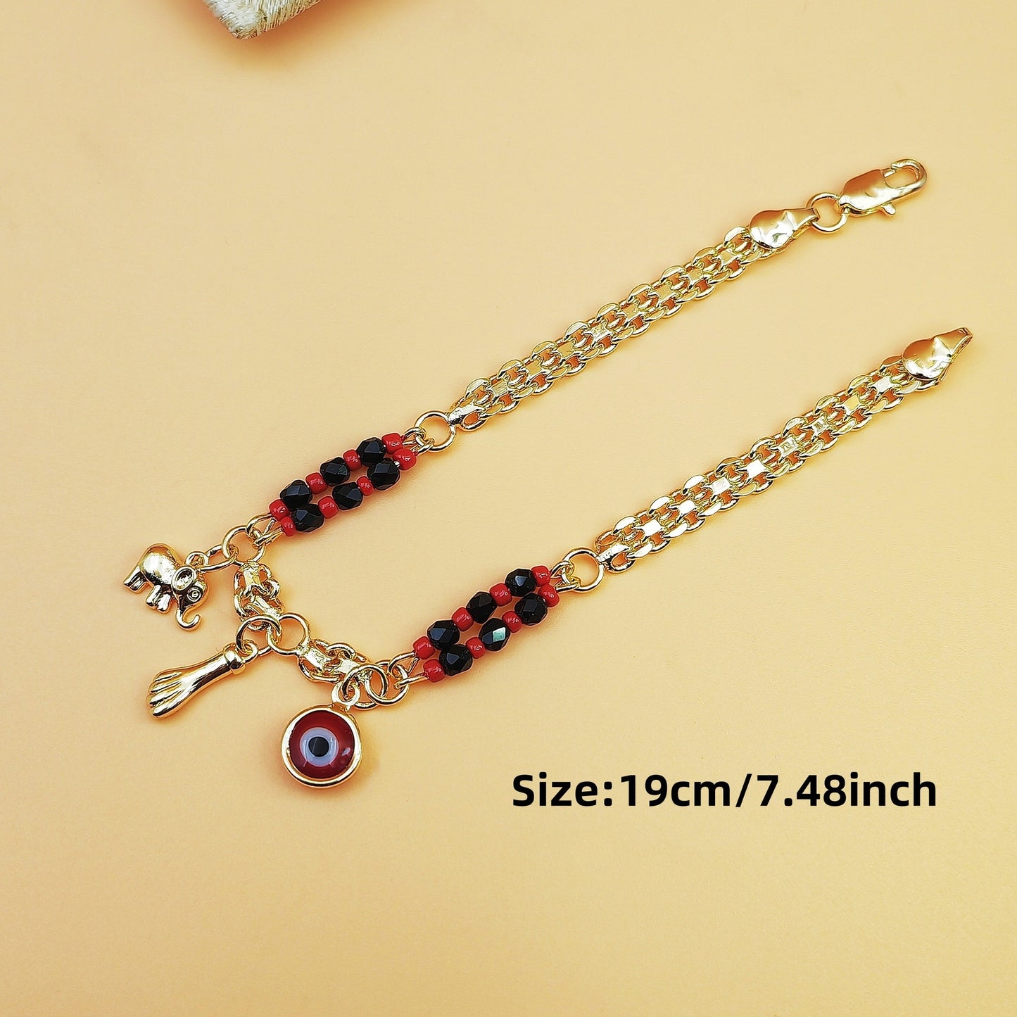 Gold-Tone Chain Bracelet with Red and Black Beads, Elephant Charm, Feather Pendant, and Round Stone Accent – 19 cm Length - Image 4