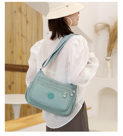 Light Blue Versatile Nylon Multi-Pocket Crossbody Bag - Lightweight Casual Travel Purse, Waterproof Horizontal Square Design - Image 2