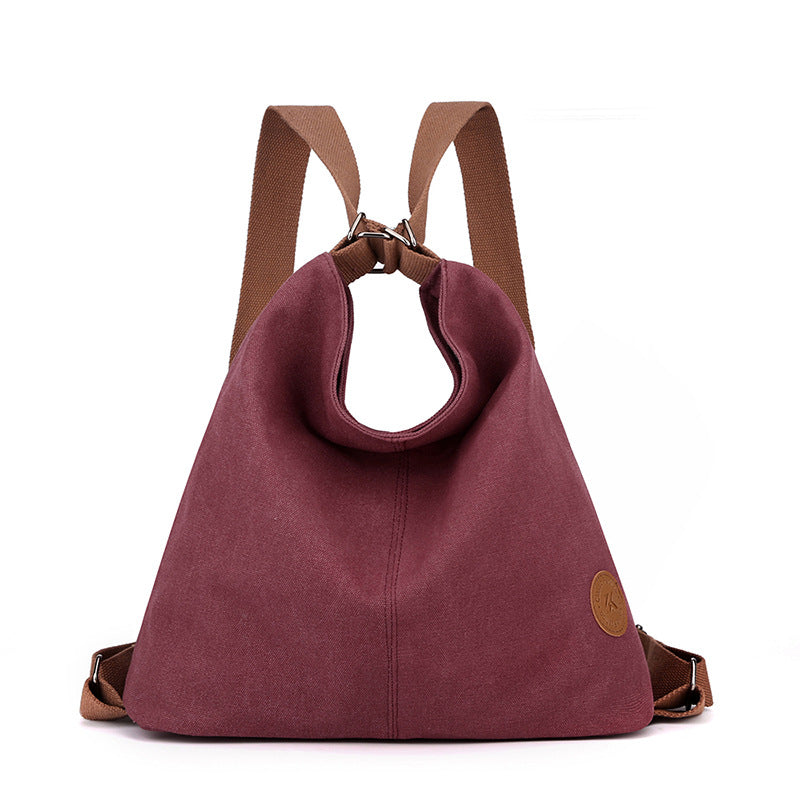 Purple Versatile 3-in-1 Canvas Backpack and Shoulder Bag Large Capacity Handbag for Women Ideal for Travel School and Everyday Use